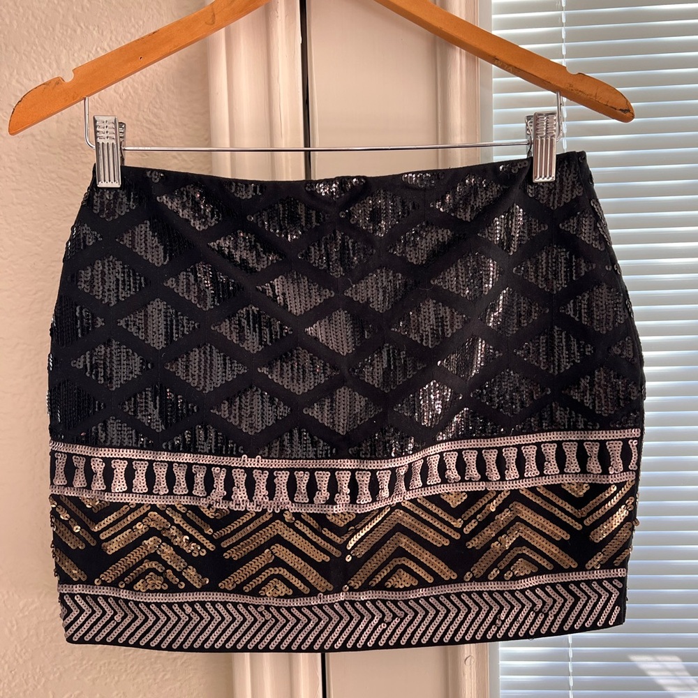 Sequin mini skirt black silver and gold.